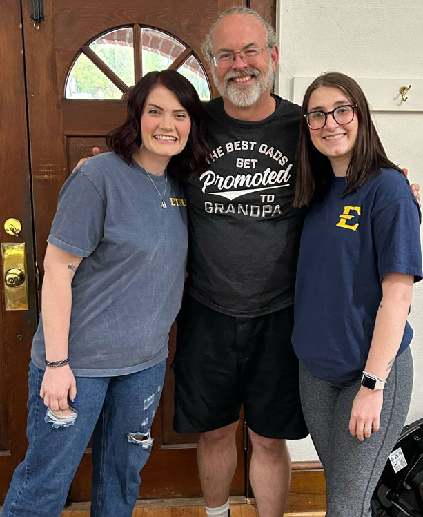 Wes is pictured with former Watauga HS students he counseled who both recently graduated from ETSU. Chloe (on the left) is now a nurse and Gracie just got hired as an English teacher for Ashe Early College.