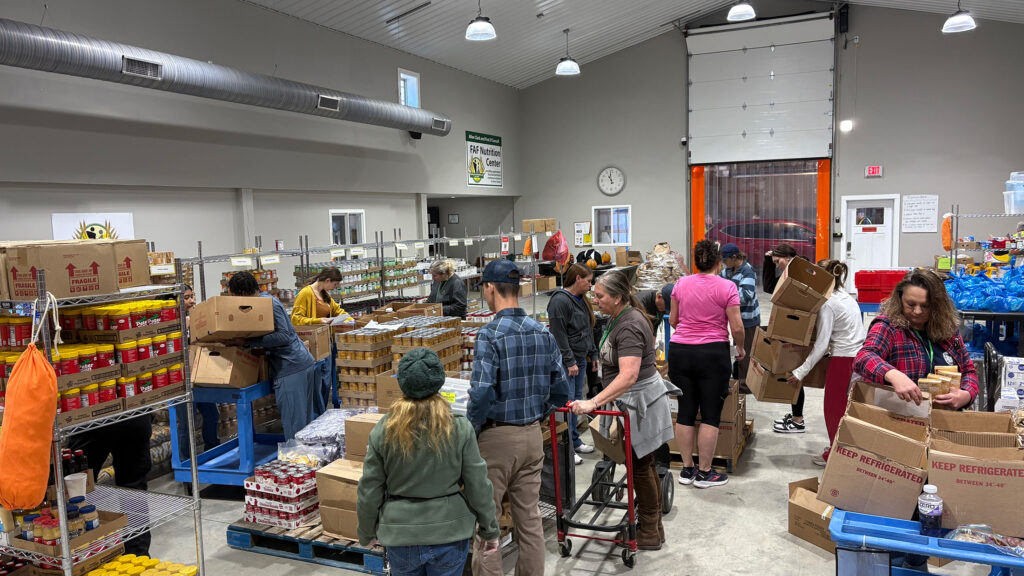 Volunteers working in the Feeding Avery Families warehouse