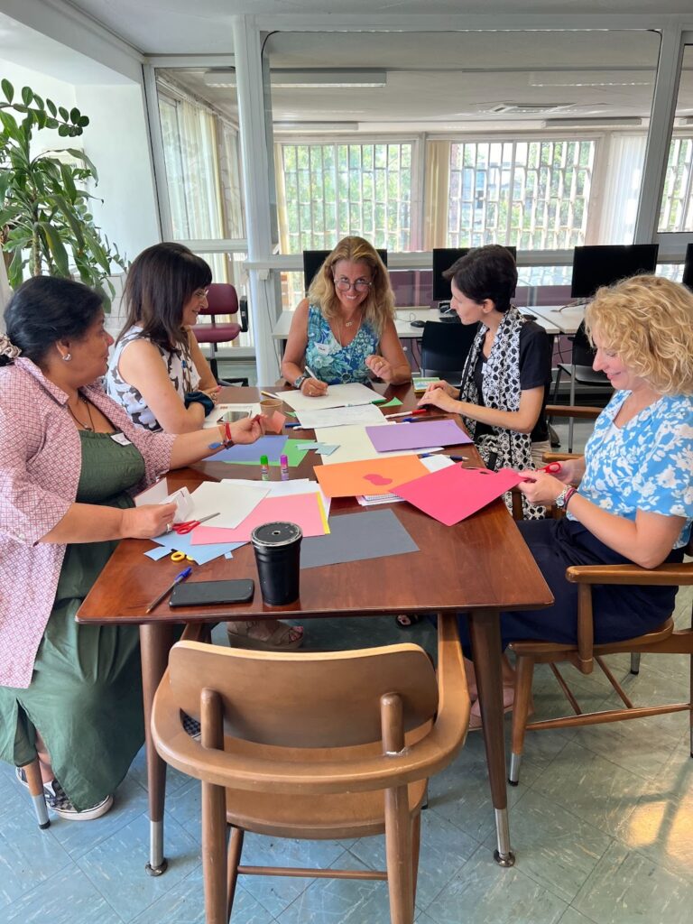 Teachers from Athens College discuss their ideal classroom environment with one another.