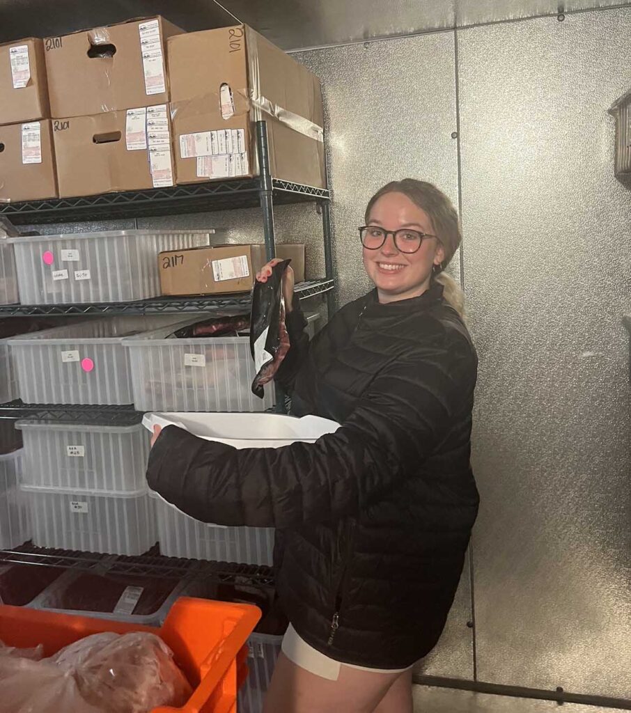 Abby Carpenter helping with storage