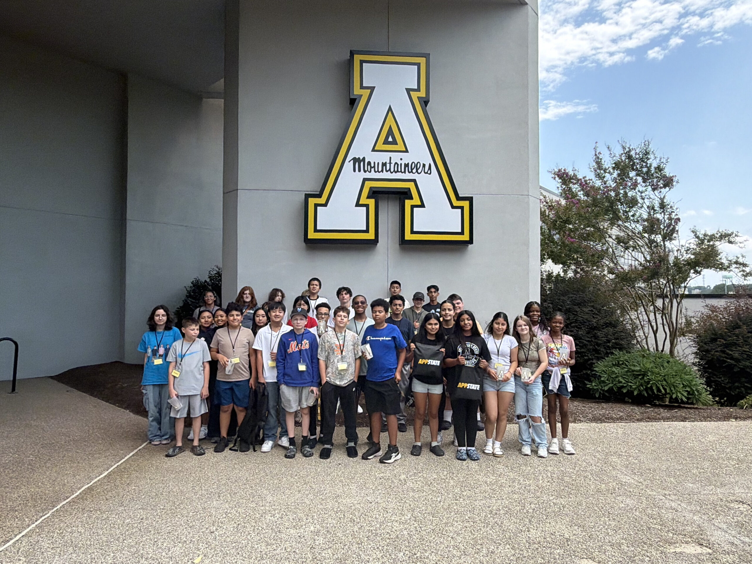 Entrepreneurship camp participants pose in front of the App State Hickory sign.
