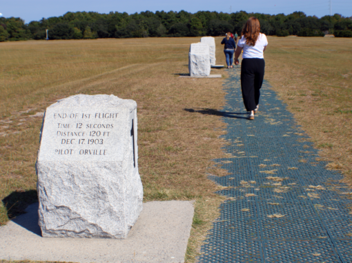 An educator from McDowell County Schools walks the path of the first flight at the Wright Brothers Memorial in September 2026. Chantal Brown/EdNC